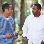 Two men walking and engaged in their discussion